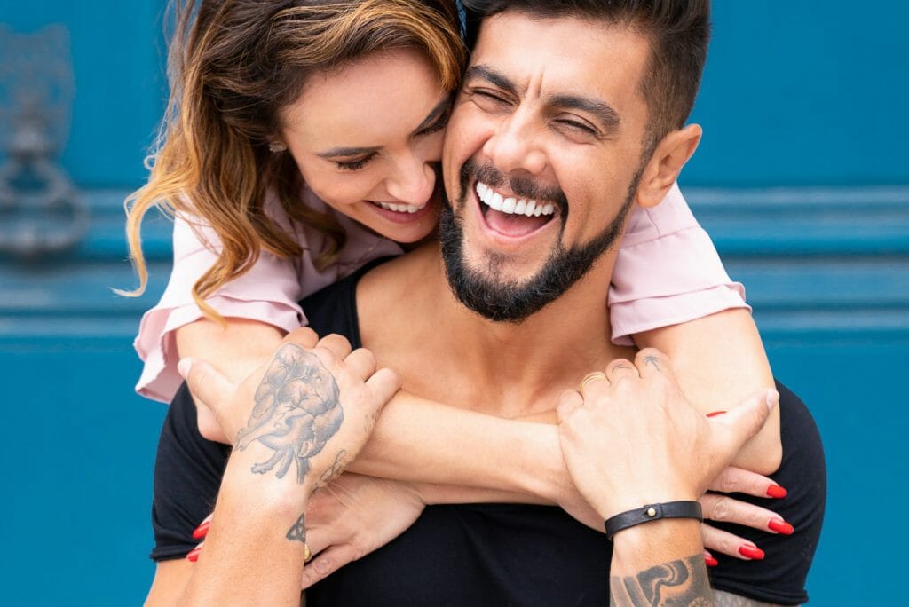Fun Couple photoshoot in Paris hugging from behind pose