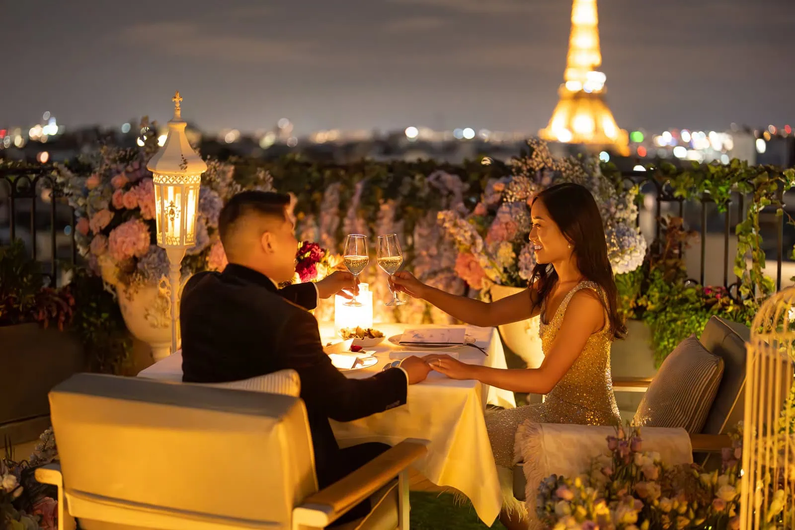 Romantic night proposal at Peninsula Paris Secret Table with private butler service, floral decor, champagne toast and sparkling Eiffel Tower view