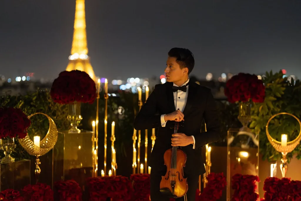 Paris violinist performing at romantic Eiffel Tower proposal at Peninsula
